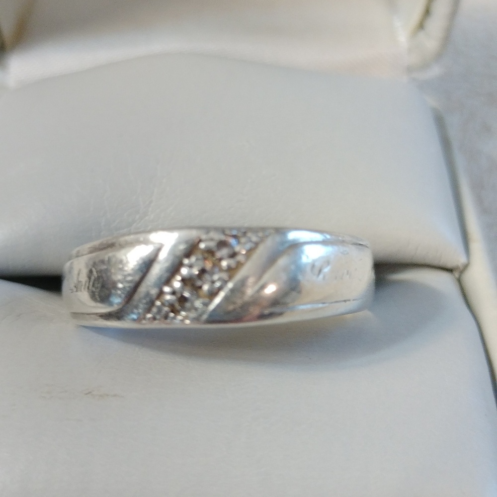 Sterling silver band with 3 tiny stones size 11 1/2